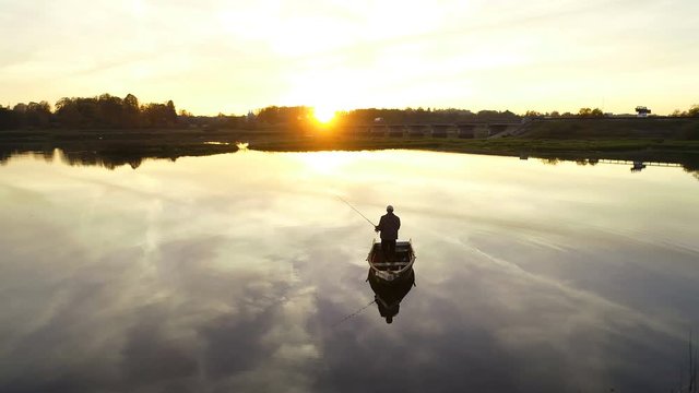 Aerial view of a fisherman in a boat on a lake