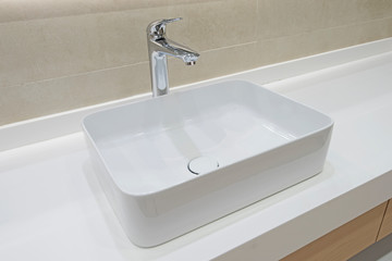 Closeup bathroom sink design in luxury apartment