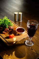 Sliced meat. Grilled beef steak on wooden cutting board. Grilled meat.