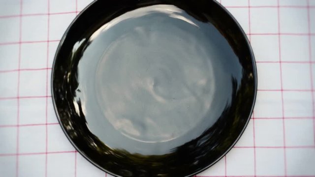 Ideal Intro for any food related short film, use your own typography in top of the plate. Girl setting and cleaning table.