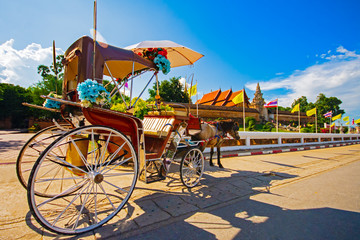 Fototapeta na wymiar The horse carriage in Lampang at Wat Phra That Lampang Luang , Lampang province in LAMPANG THAILAND.
