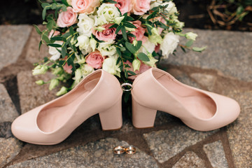 bridal bouquet, bride's shoes and rings