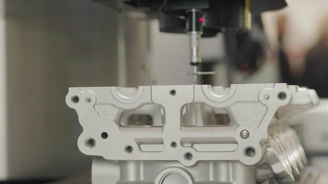 Detail in 3D CNC coordinate measuring machine, video and touch probe measurement module system with a 5-way stylus. Probe arm with multi-sensor automatically inspecting complex high-curvature detail