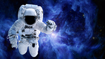 Fototapeta na wymiar Alone Astronaut in outer space near the Sword of Orion. Science fiction wallpaper. Elements of this image were furnished by NASA