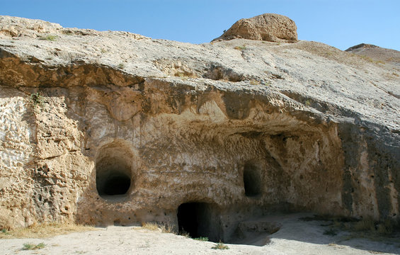 Takht-e Rostam (Takht-e Rustam) is a stupa monastery in northern Afghanistan. Entrance to the cave monastery with rooms inside. Takht e Rostam is between Mazar i Sharif and Pol e Khomri, Afghanistan.
