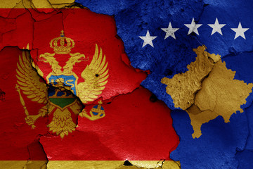 flags of Montenegro and Kosovo  painted on cracked wall