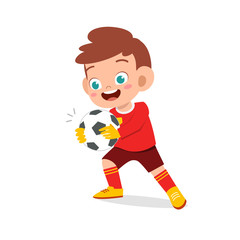 happy kid boy play soccer as goalkeeper