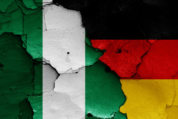 flags of Nigeria and Germany painted on cracked wall