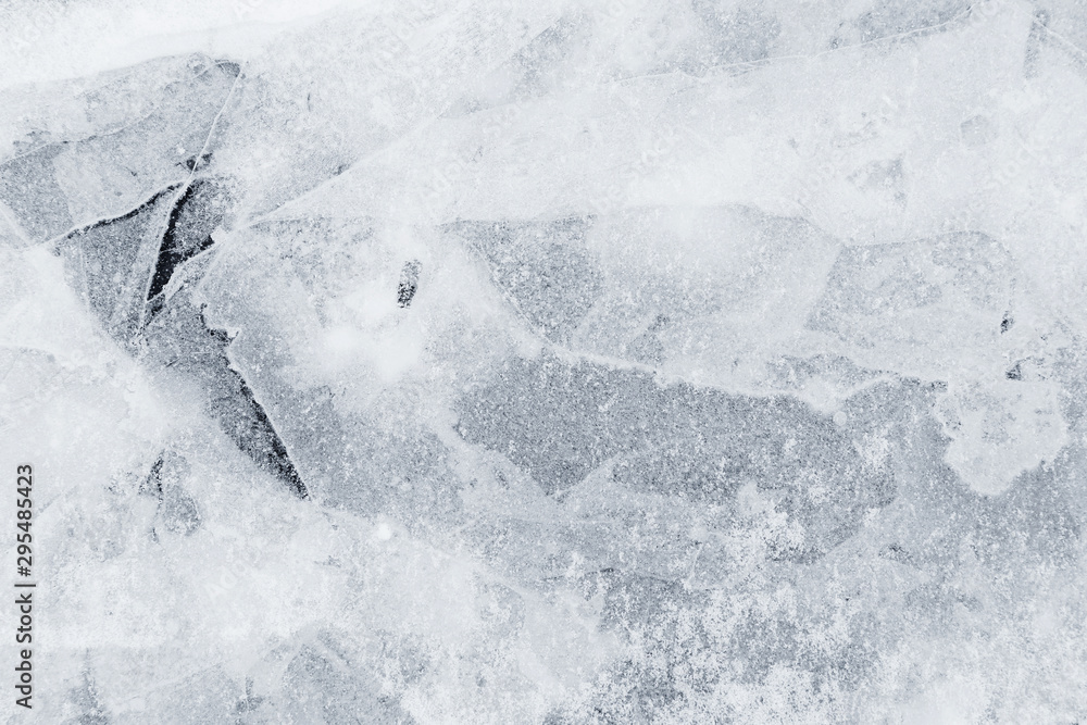 Poster close-up of snow on cracked and thin layers of ice in the winter. simple and minimal full frame abst