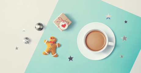 Christmas ornaments with a cup of coffee - flat lay