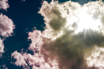 Cloud background. Dramatic clouds cover the blue sky.