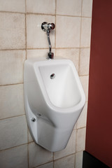 White urinal men in public toilet