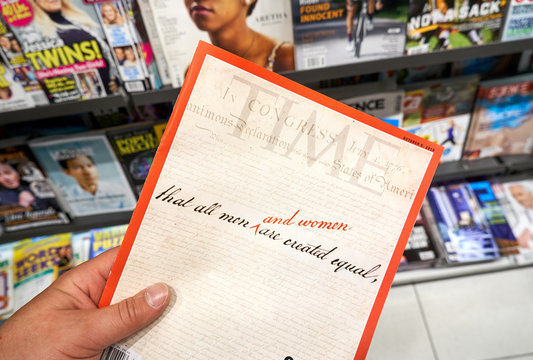 Time magazine in a hand