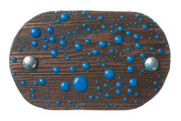 Beautiful blue paint on a wooden surface with shiny bolts. Isolated on white background.
