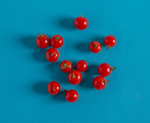Naklejka na ściany i meble Cherry tomatoes are on the pool table.