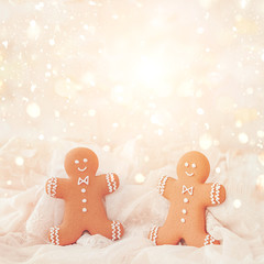 gingerbread man cookies on abstract festive background. traditional tasty cookies for Christmas and new year. holiday winter concept. copy space. soft selective focus