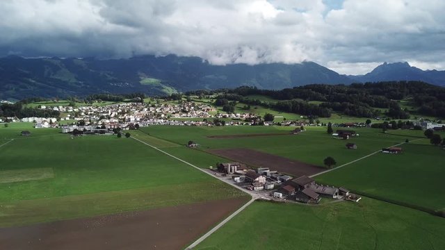 Pleasantful green tranquil village lands of Benken, Zurich Switzerland, aerial shot 