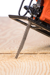jigsaw saw a sheet of plywood or wood, prongs close-up macro