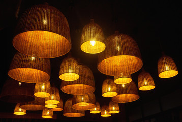 Local shaped lamps on ceiling against dark background, many local ceiling lamps with abstract...