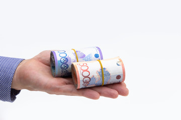 Rolls of tenge banknotes