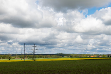 Power lines running over fields in Oelsted (Ølsted), Denmark, Scandinavia, Europe