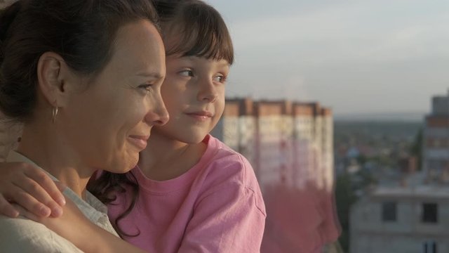 The family looks out the window.