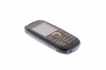 Old vintage mobile phone with buttons on a white background.