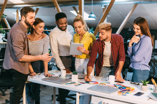 Colleagues working together with tablet and palette