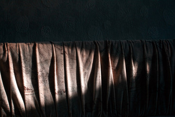 sunlight and shadow falls on a sofa