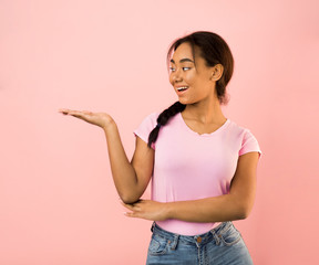 Teen girl demonstrating something on her empty palm