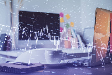 Financial market graph hologram and personal computer on background. Double exposure. Concept of forex.