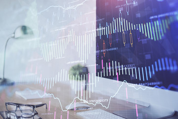 Forex Chart hologram on table with computer background. Multi exposure. Concept of financial markets.