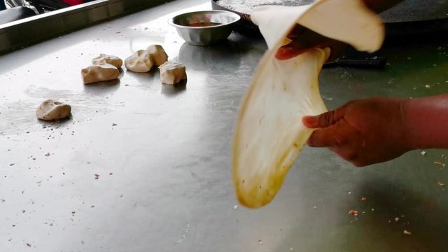 Clips of Roti Parata or Roti canai in the making process.