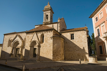 Fototapeta na wymiar Collegiate church of San Quirico in the Romanesque style located in the medieval Tuscan village of San Quirico d'Orcia