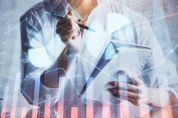 Financial chart drawn over hands taking notes background. Concept of research. Multi exposure