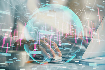 Double exposure of forex graph with man working on computer on background. Concept of market analysis.