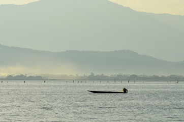 peaceful of lake with mountain view at Phayao lake in Thailand