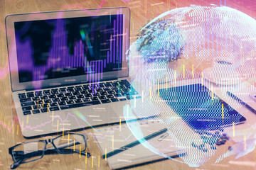 Multi exposure of graph and financial info and work space with computer background. Concept of international online trading.