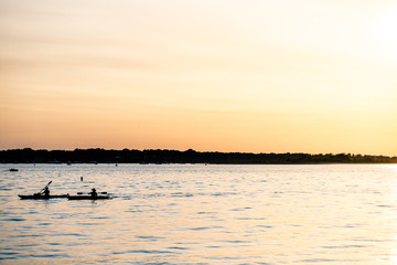 Silhouette kayak canoe sunset