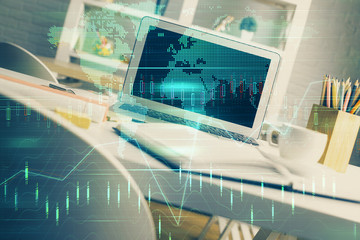 Multi exposure of graph and financial info and work space with computer background. Concept of international online trading.