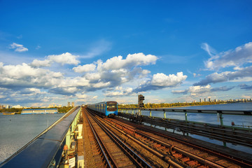 Fototapeta na wymiar train goes bridge over the Dnieper in Kiev
