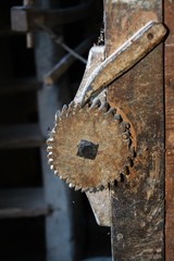 an old wooden sprocket with lock