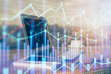 Forex market chart hologram and personal computer background. Double exposure. Concept of investment.