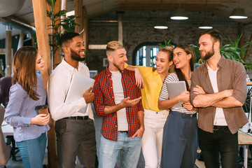 Successful workers having break, talking and laughing