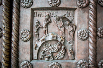 Fragment of bas-relief gate of the Cathedral of Pisa (Cathedral of the assumption of the blessed virgin Mary). Pisa, Tuscany, Italy