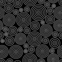 Seamless abstract pattern with white circles on black background