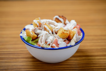 Close up of chicken salad in a bowl on a table