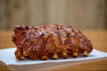 cooked rack of bbq ribs
