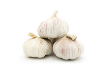 3 whole fresh garlic close-up isolated on white background