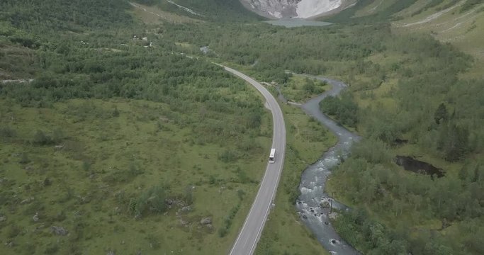 4k drone view of Norwegian valley and Briksdal, Briksdalsbreen glacier aerial shot colorful, river